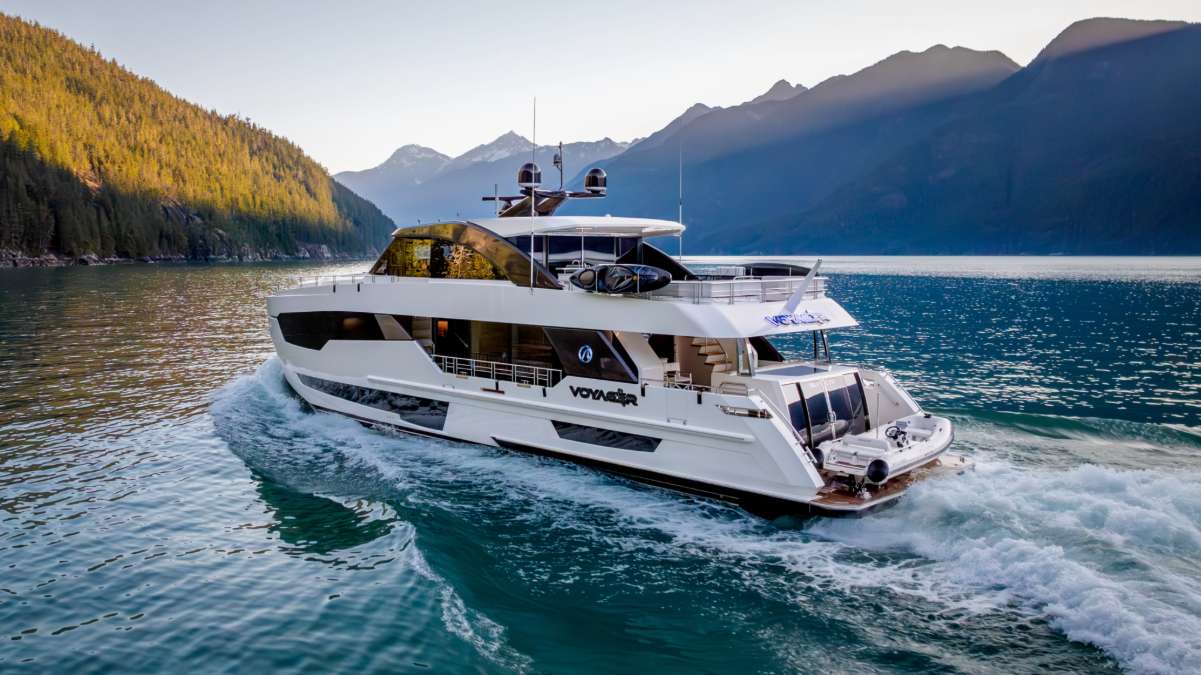 A steep, green-walled fjord with sun breaking through — a smaller-scale corridor than the marquee anchorage the day before.