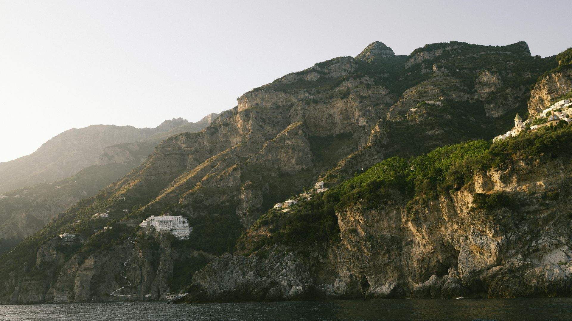 Aerial of the Amalfi Coast — terraced cliff villages from Positano to Amalfi