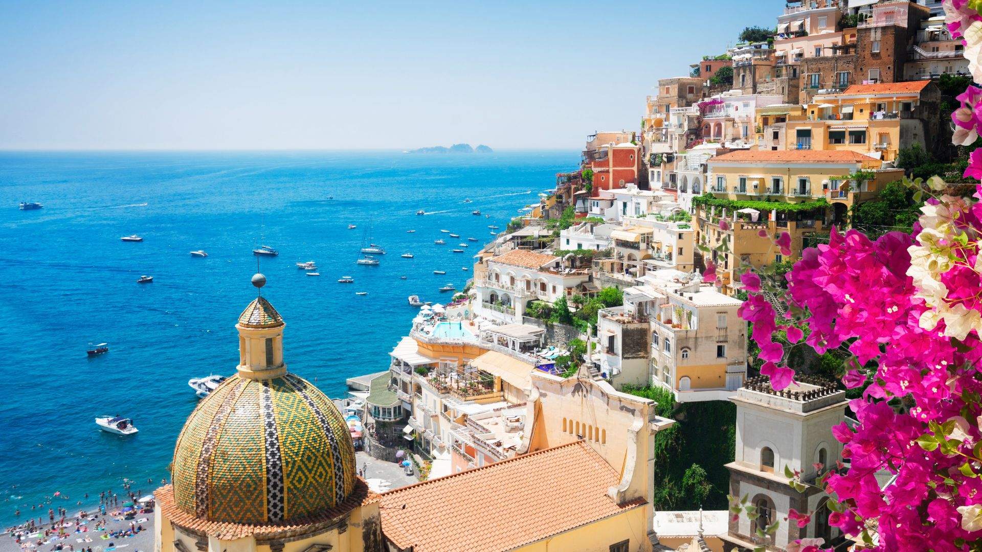 Positano's cliff-stack rising from Spiaggia Grande.