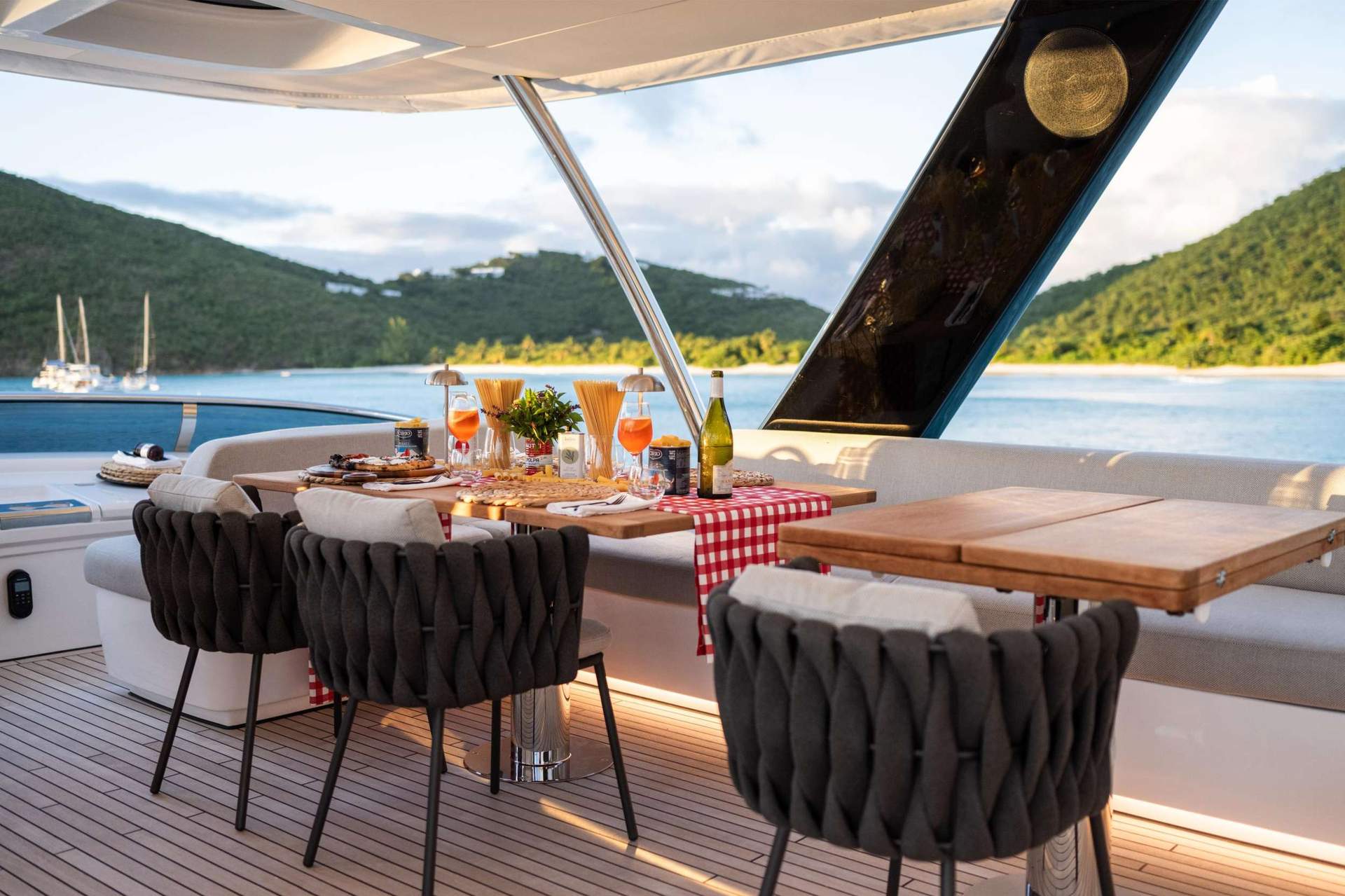 Aft-deck dinner aboard a crewed yacht on the Mediterranean
