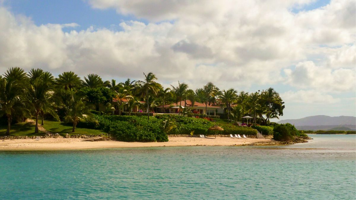 Long Island, home to Jumby Bay, on the way into the reef-strewn North Sound — the last Antigua anchorage before the Barbuda crossing.