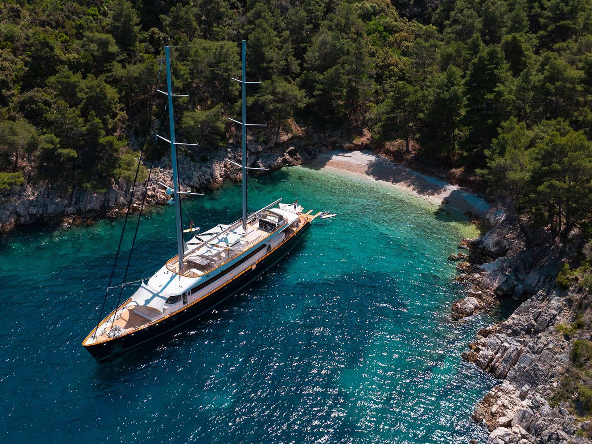 A traditional sailing yacht at anchor in a protected Dalmatian cove.