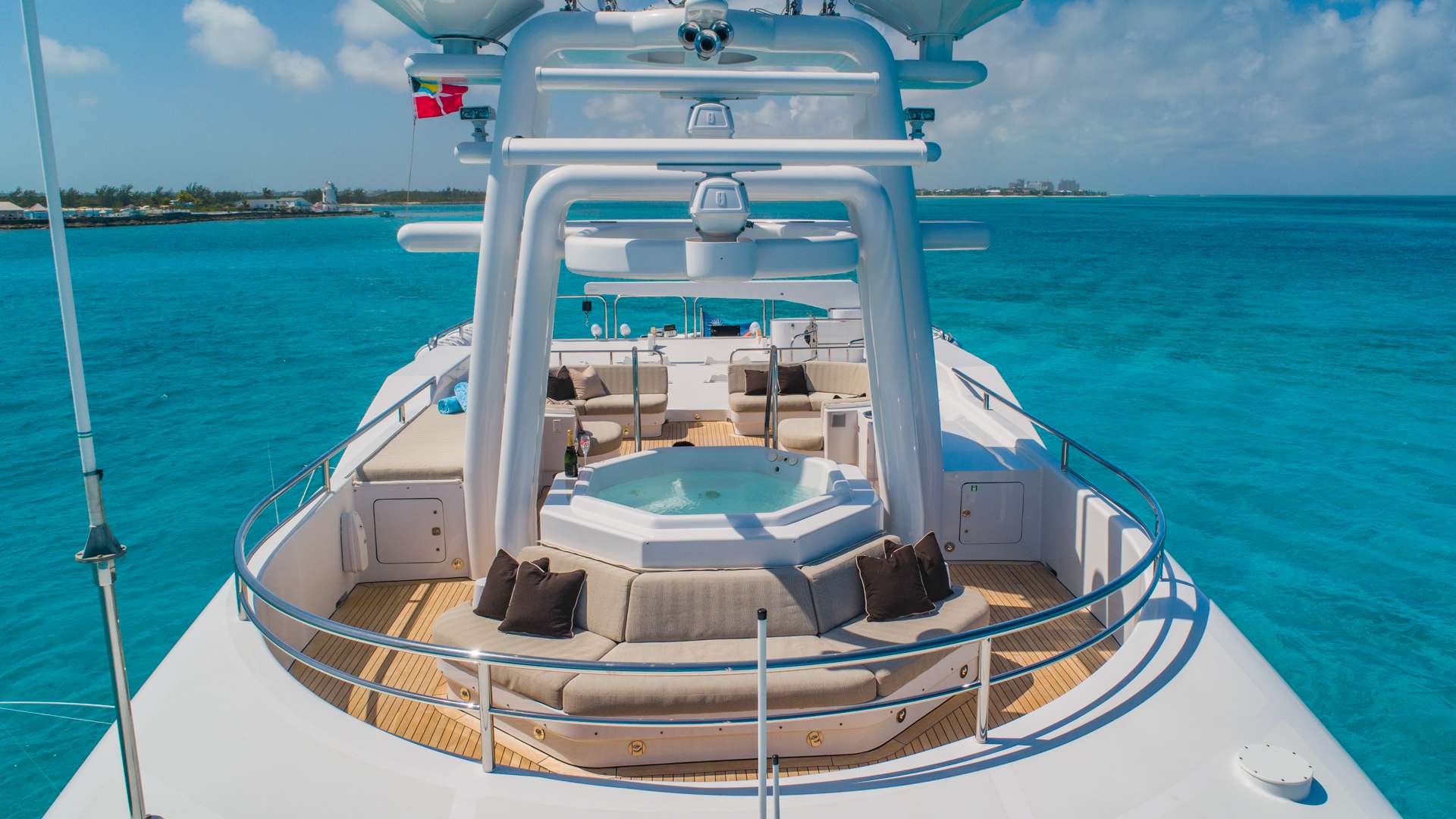 Sundeck and jacuzzi aboard a crewed motor yacht in the Bahamas
