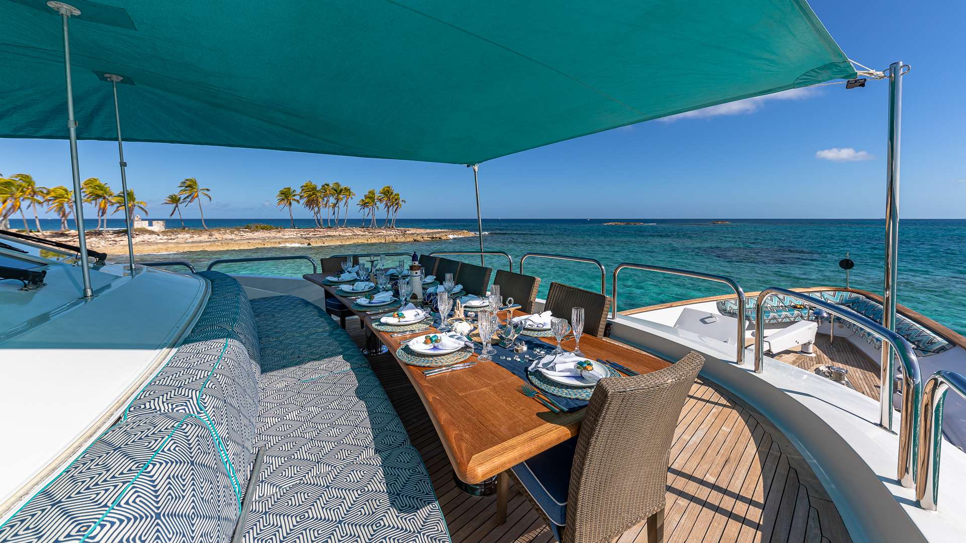 Al fresco dining on the deck of a crewed yacht in the Bahamas
