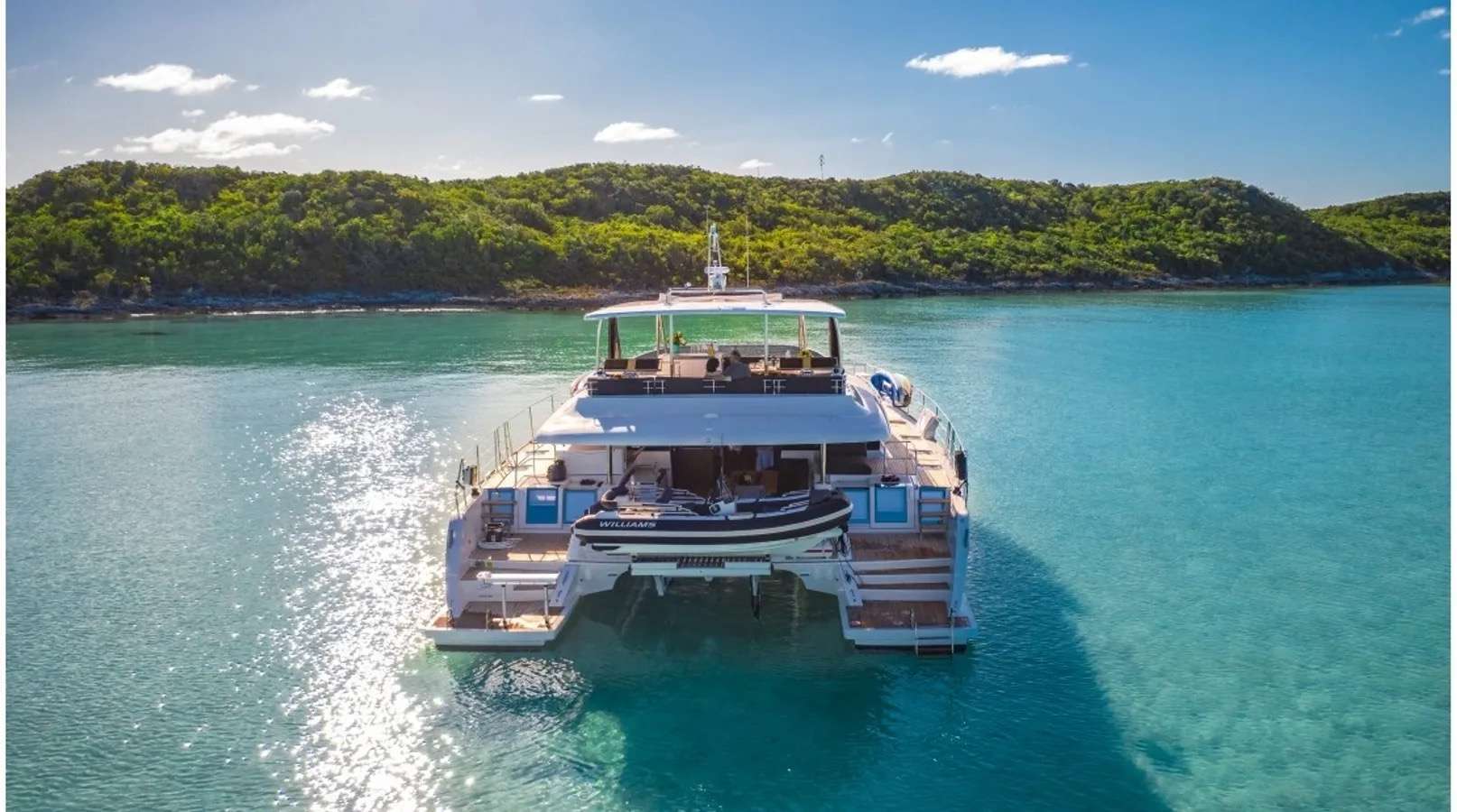 Crewed catamaran at anchor in the Exuma Bahamas
