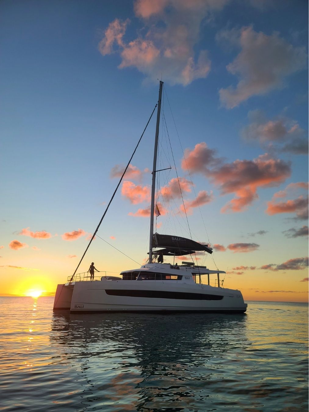 Crewed catamaran at sunset in the Exuma Bahamas