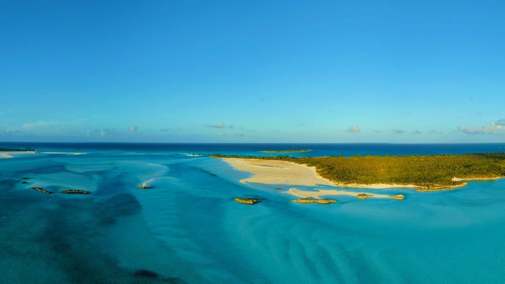 Golden-hour sandbars off the northern tip of Hawksbill Cay in the Exumas.