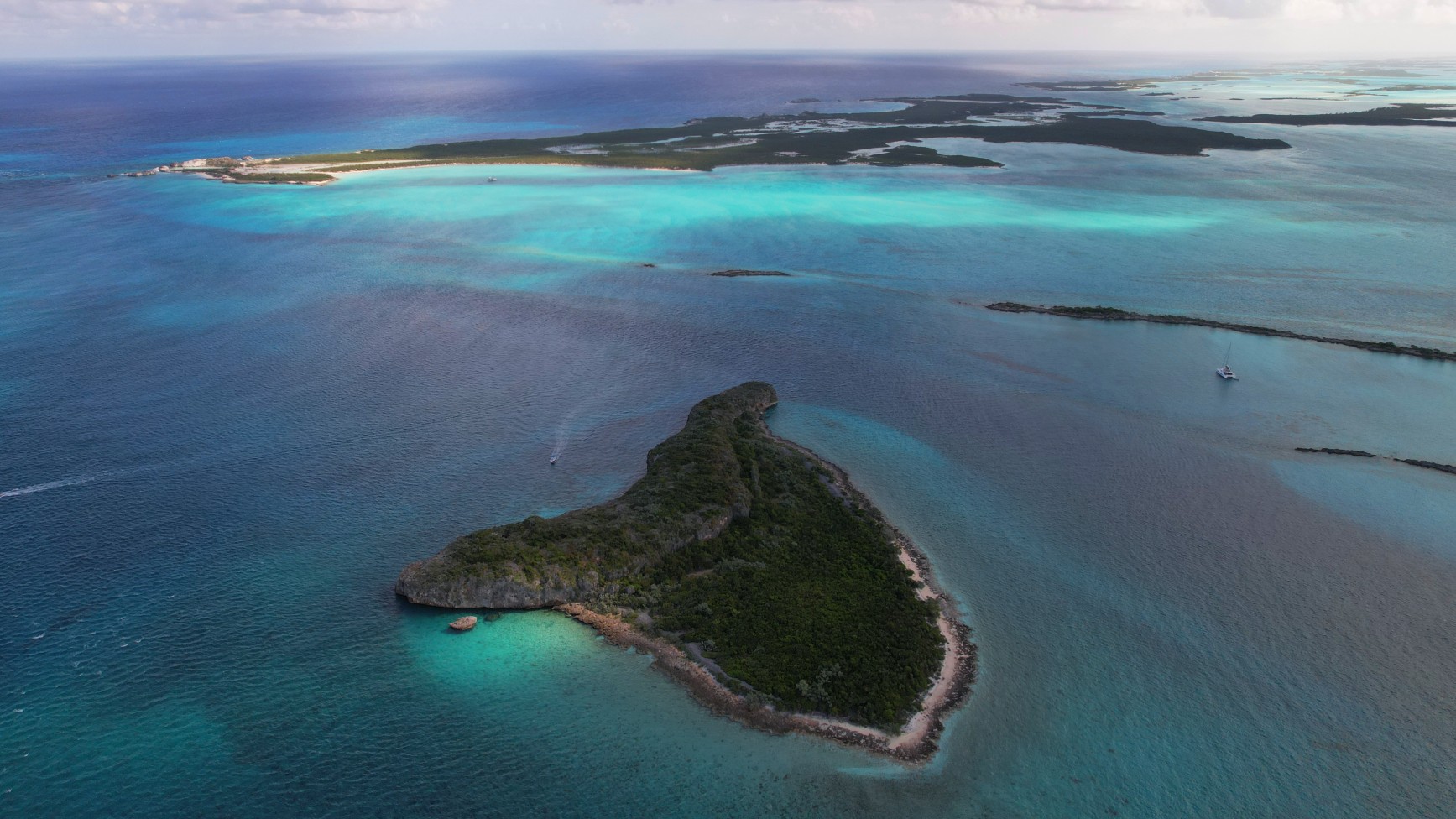 Rocky Dundas from the air — the grotto caves hide in the cliff line at the waterline.