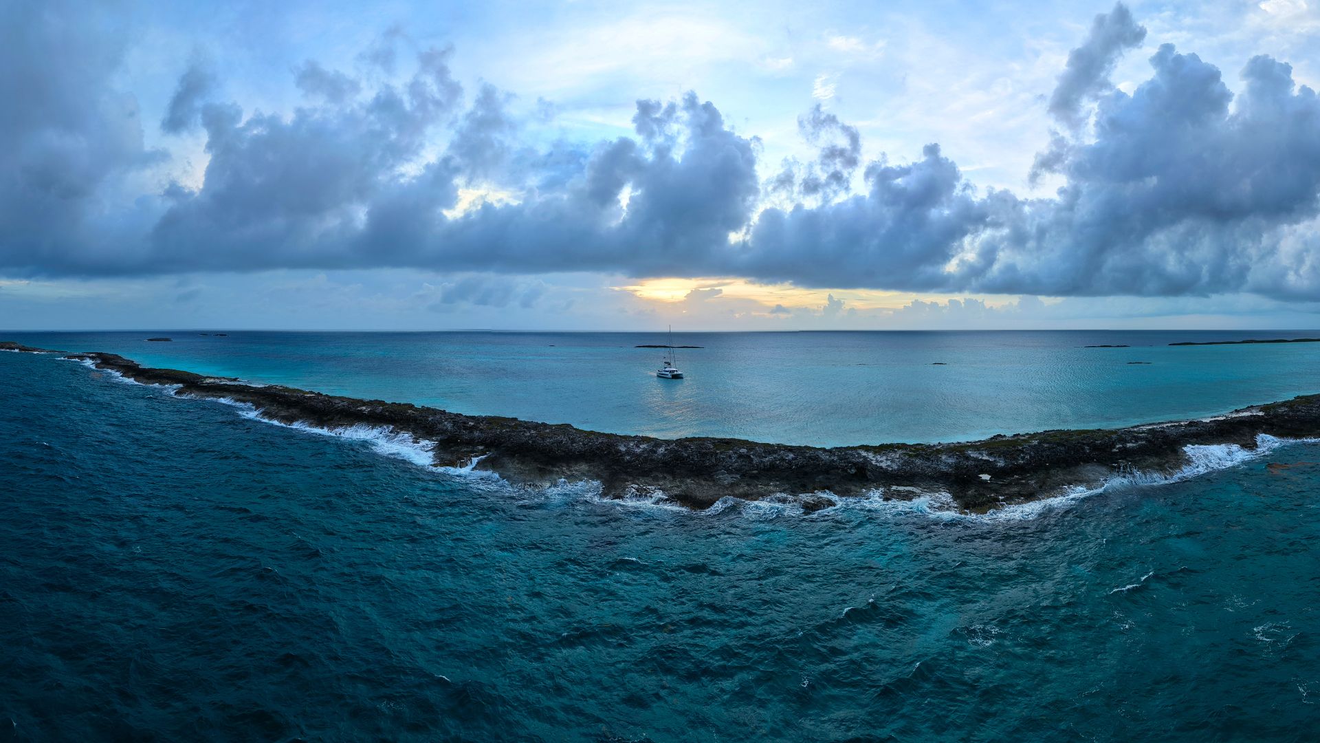 Sunset over the Exuma cays from a crewed yacht charter