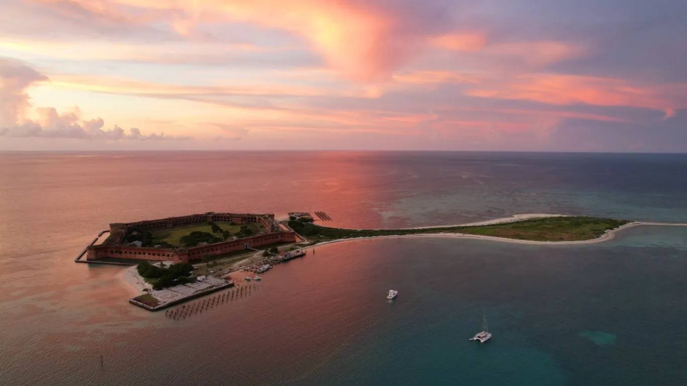 Sunset aerial over Fort Jefferson with a catamaran and a motor boat anchored off Garden Key