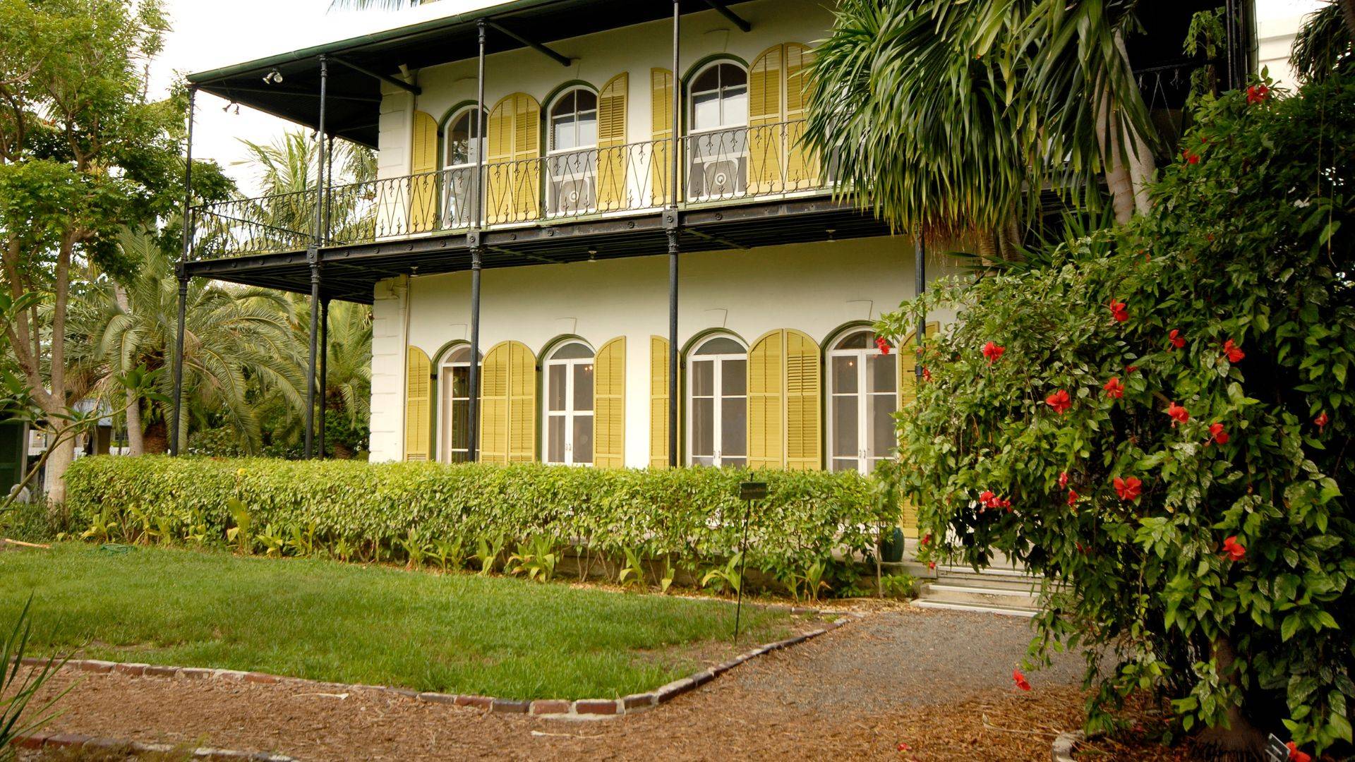 The Hemingway Home on Whitehead Street — the study, the cats, and the town's literary spine.
