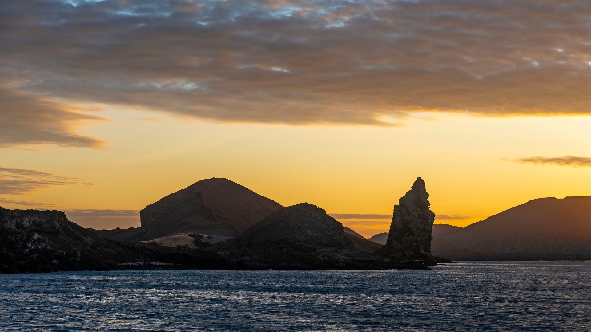 Pinnacle Rock and Bartolomé silhouetted against a Galapagos sunset