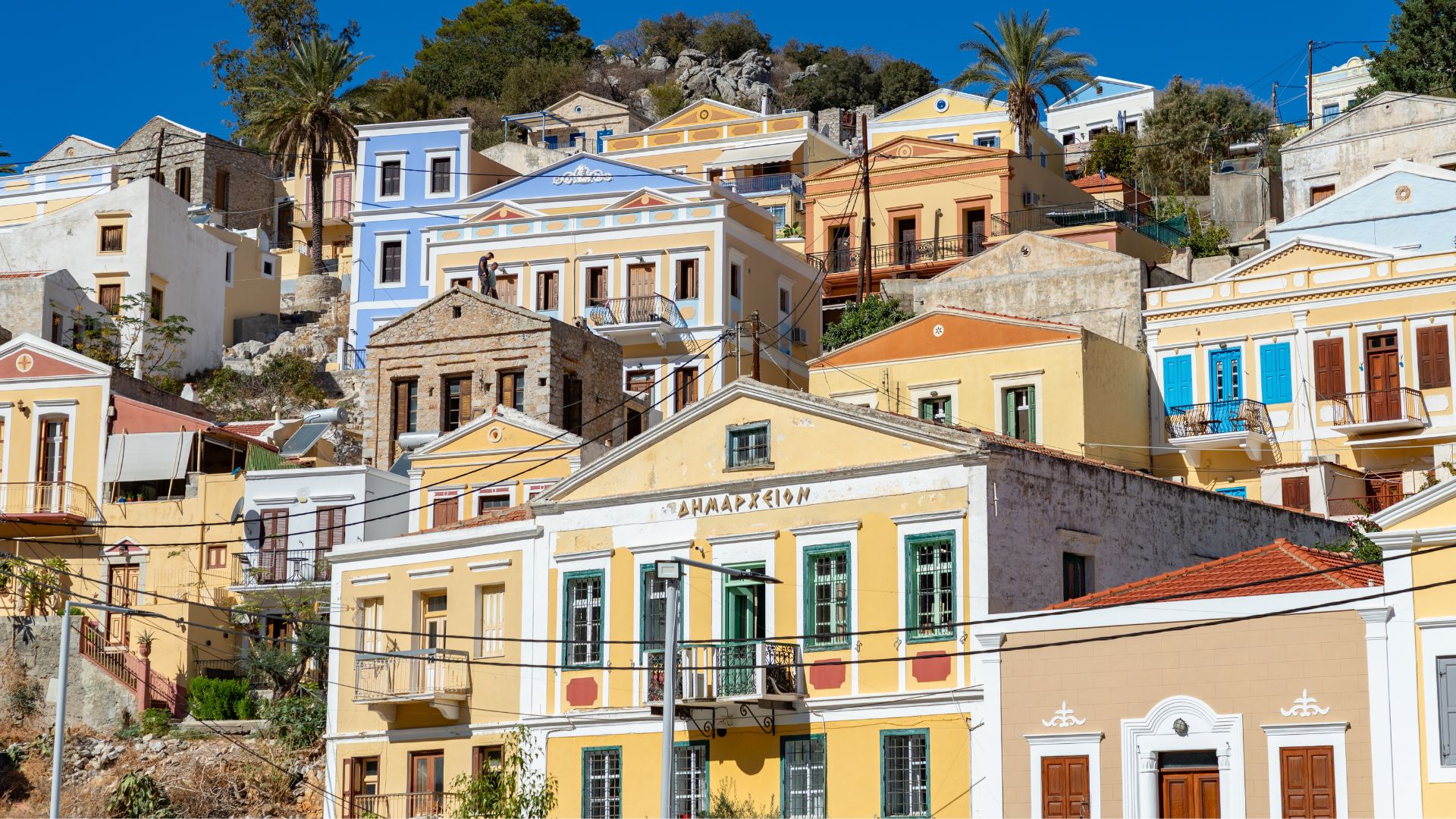 Symi — built by 19th-century sponge merchants and preserved by accident.