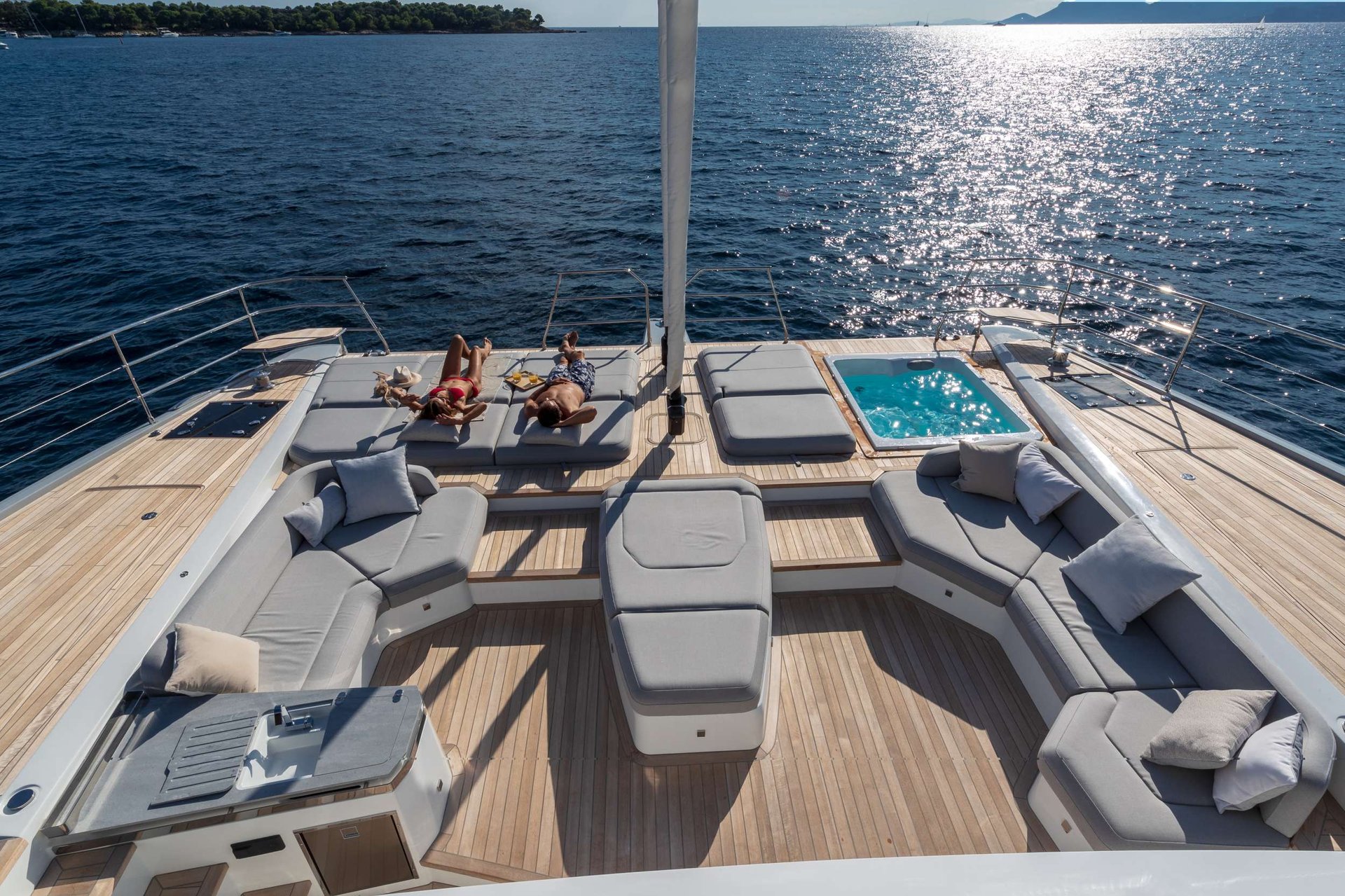 Quiet afternoons on the hook are the secret to a Cyclades week—deck time between the marquee stops with the breeze blocked by the island.
