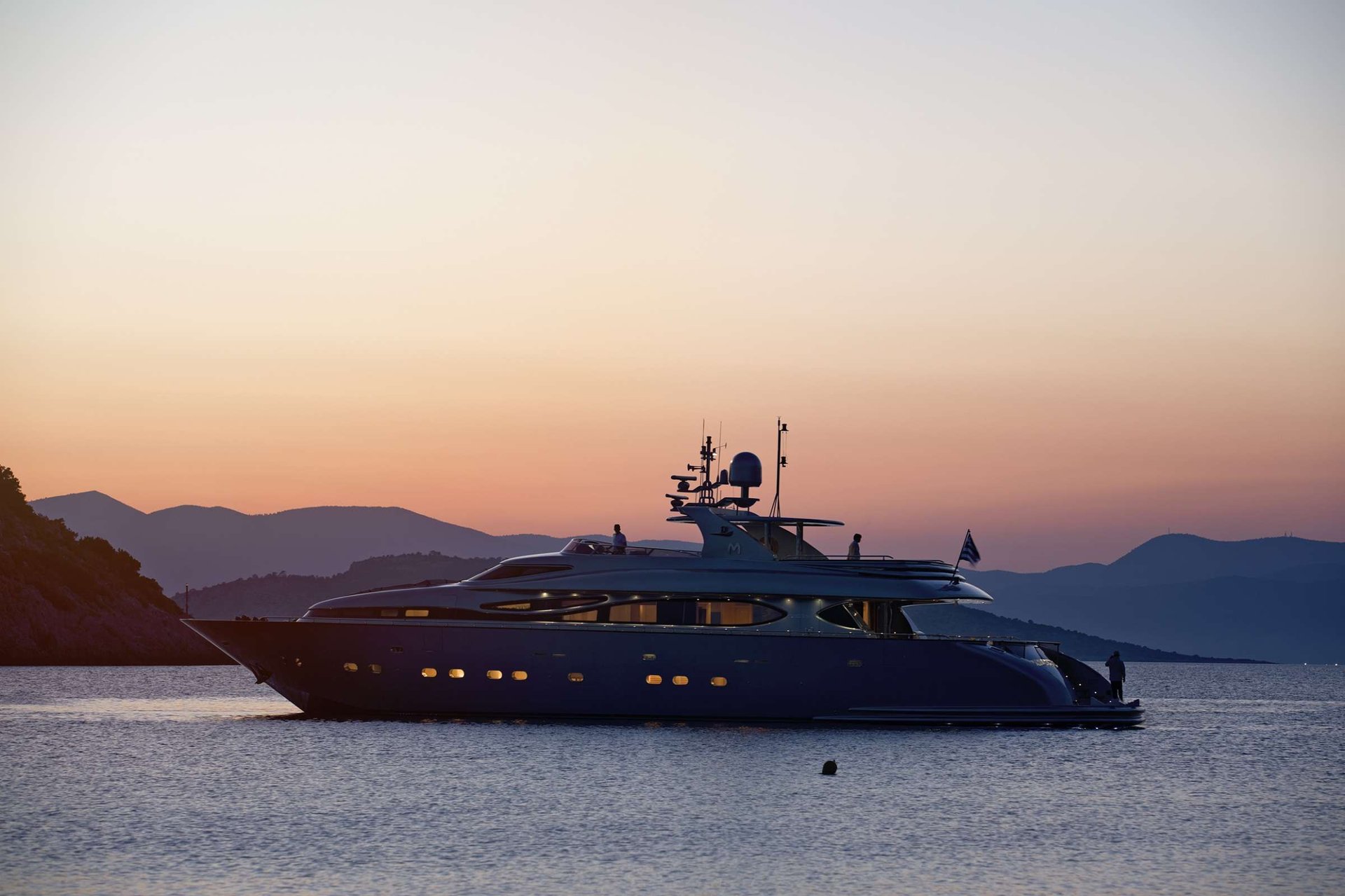 Last full day on the boat—pastel sky, layered island silhouettes, the engines off and nothing on the schedule.
