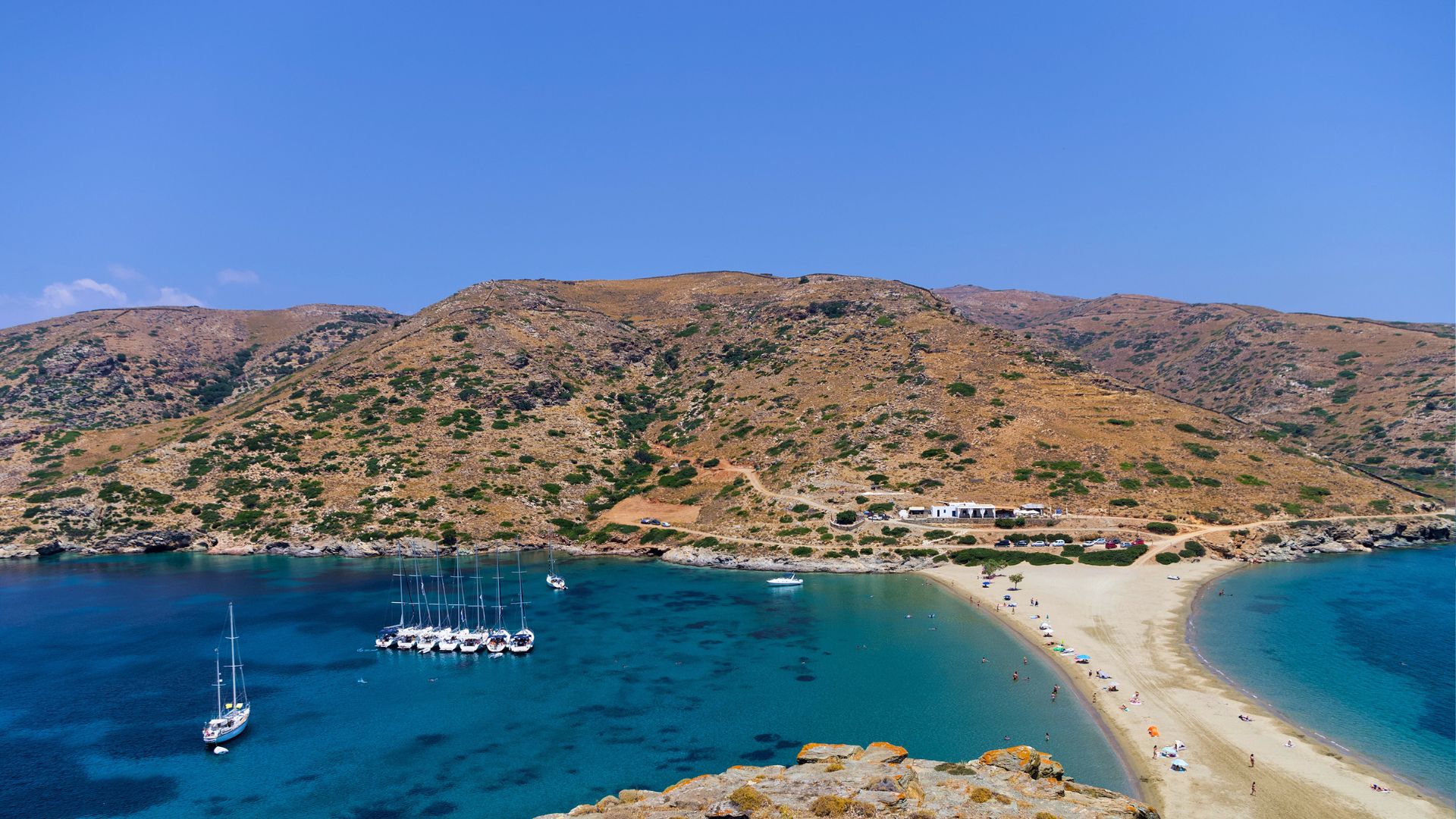 Kolona on Kythnos is a thin strip of sand with open sea on both sides—one of the most distinctive anchorages in the Aegean.