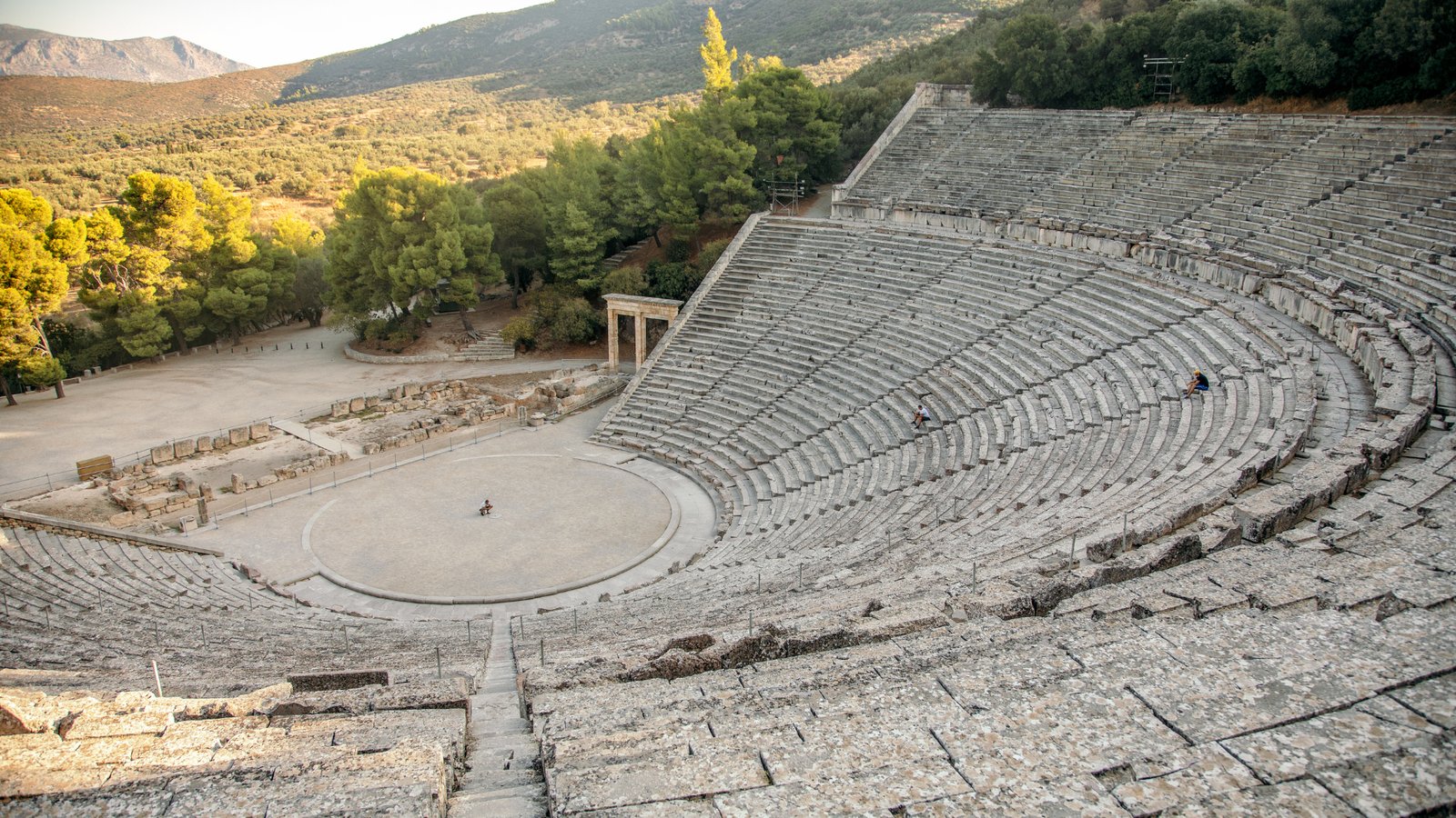 The stone amphitheater at Epidaurus carved into the hillside.