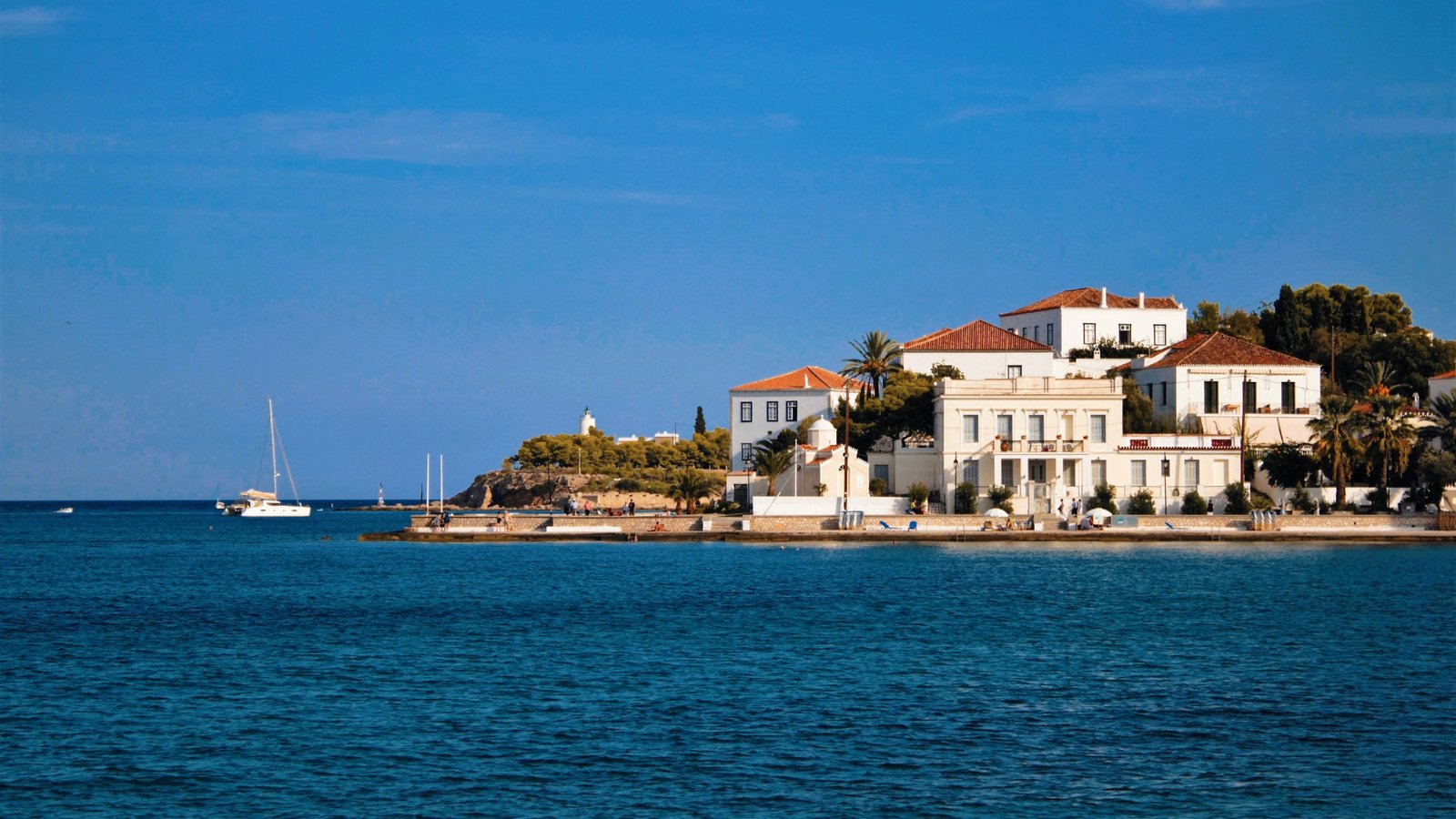 Spetses Old Harbor with the Poseidonion above the waterfront.