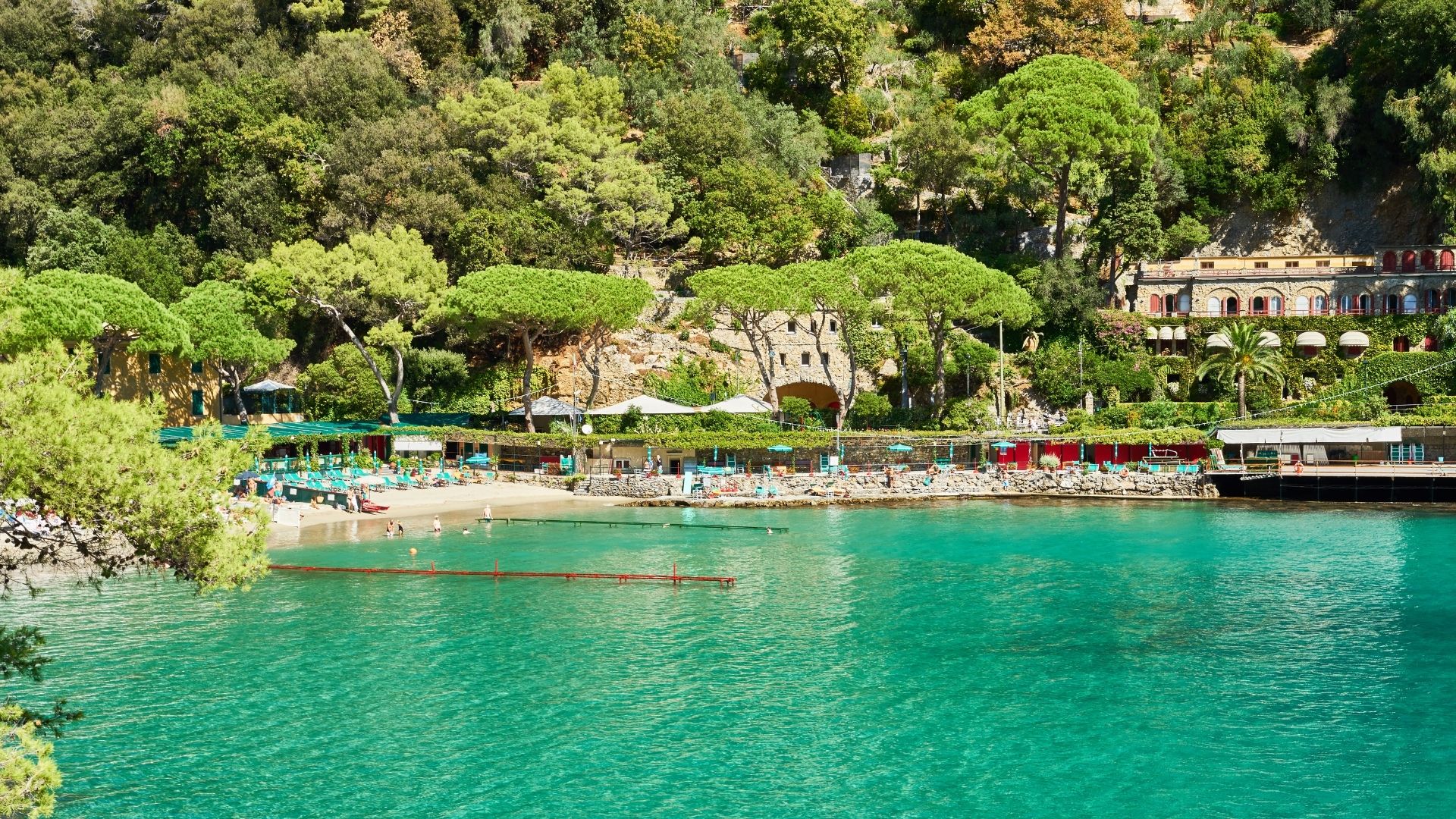 Morning swim stop in Paraggi or at one of the Tigullio coves before the southward push. The Langosteria beach club at Paraggi runs the more polished lunch option; the Bagni Fiore terrace is the older, quieter one above the bay.