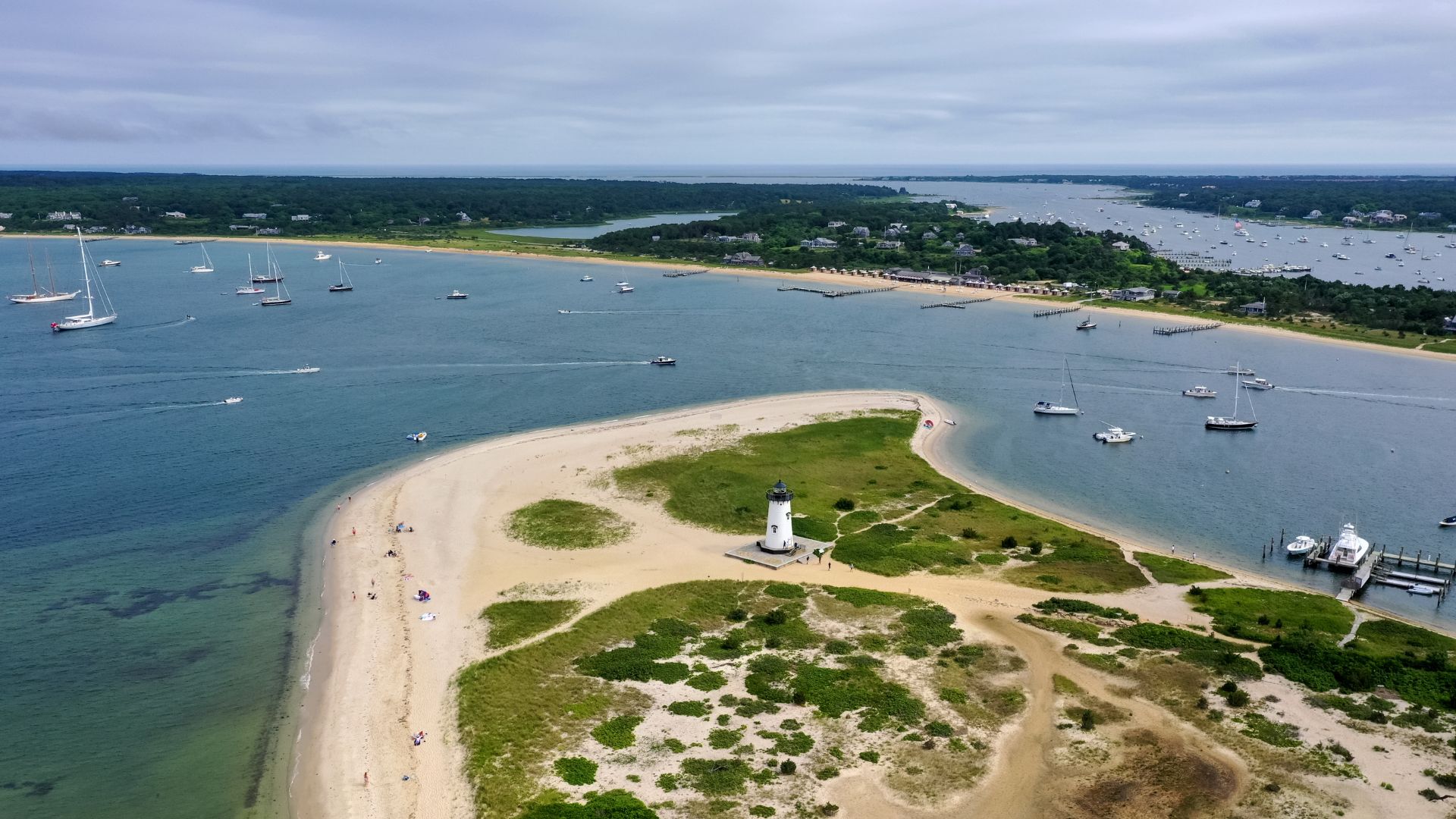Edgartown Light on its sand spit with the harbor fleet beyond, Martha's Vineyard