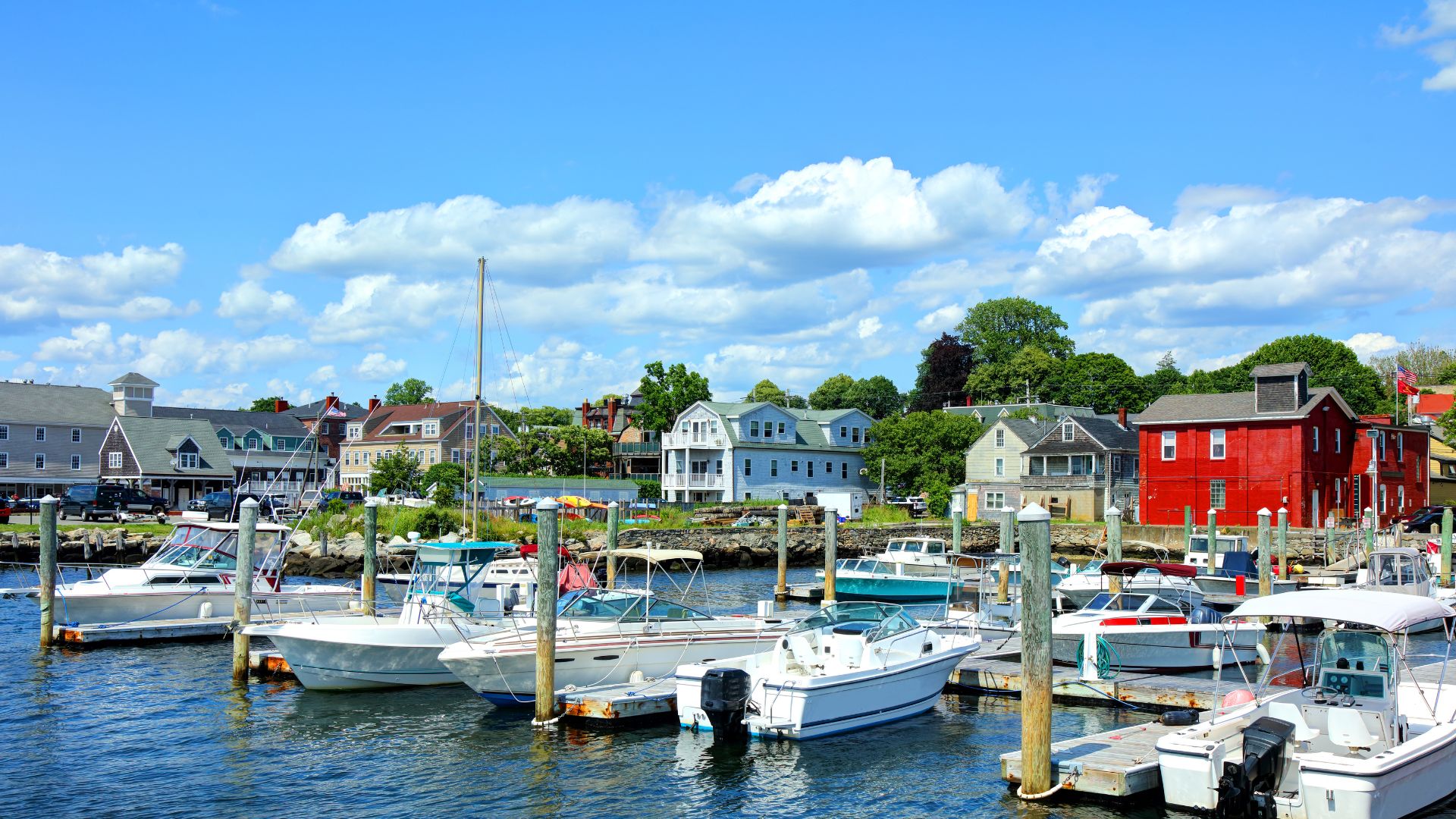 Bristol Harbor still works for a living — the Herreshoff yard here built five consecutive America's Cup defenders between 1893 and 1920.