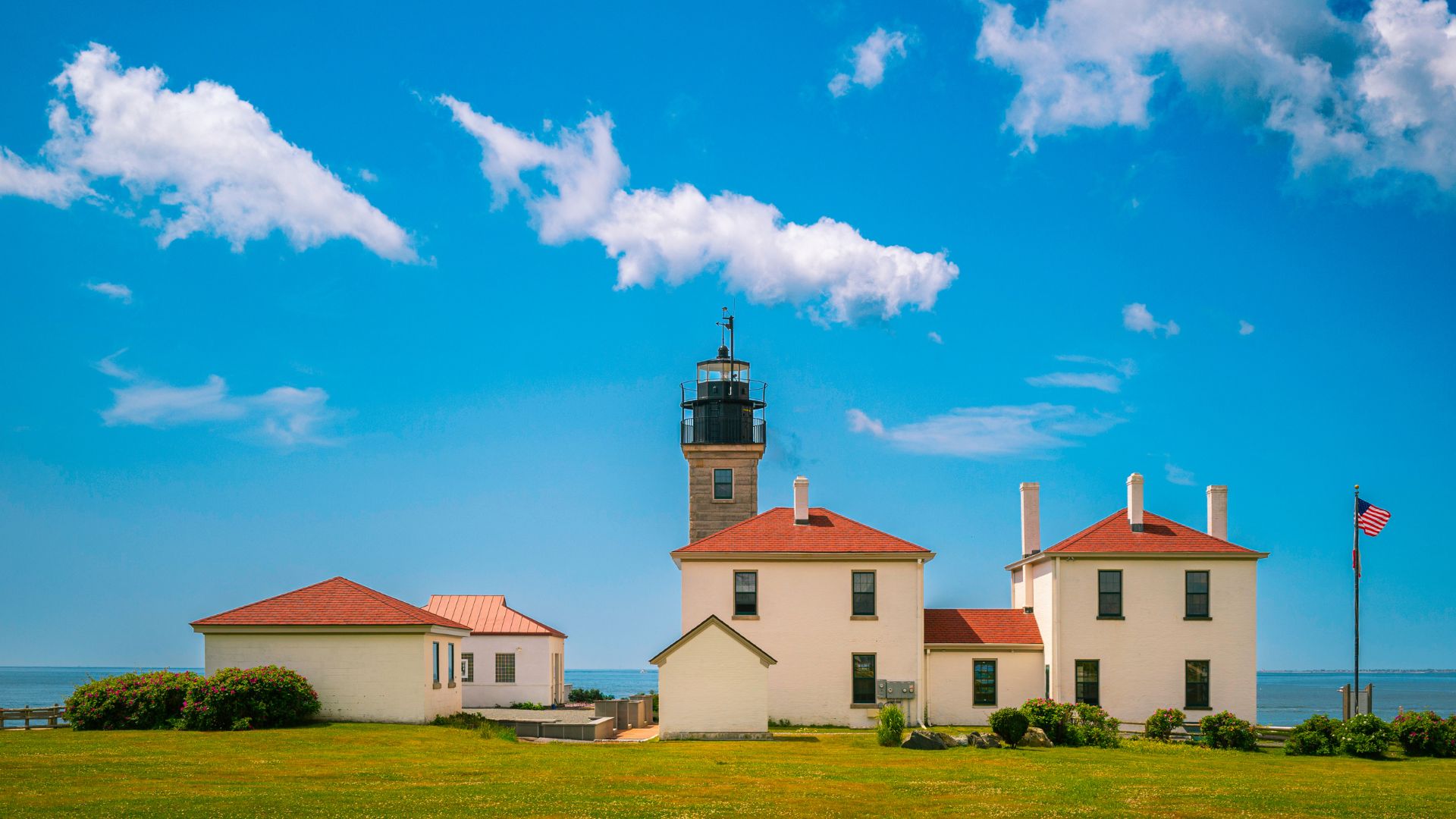Beavertail Light, guarding the West Passage since the 1850s — the first landmark of the week, twenty minutes from the Newport docks.