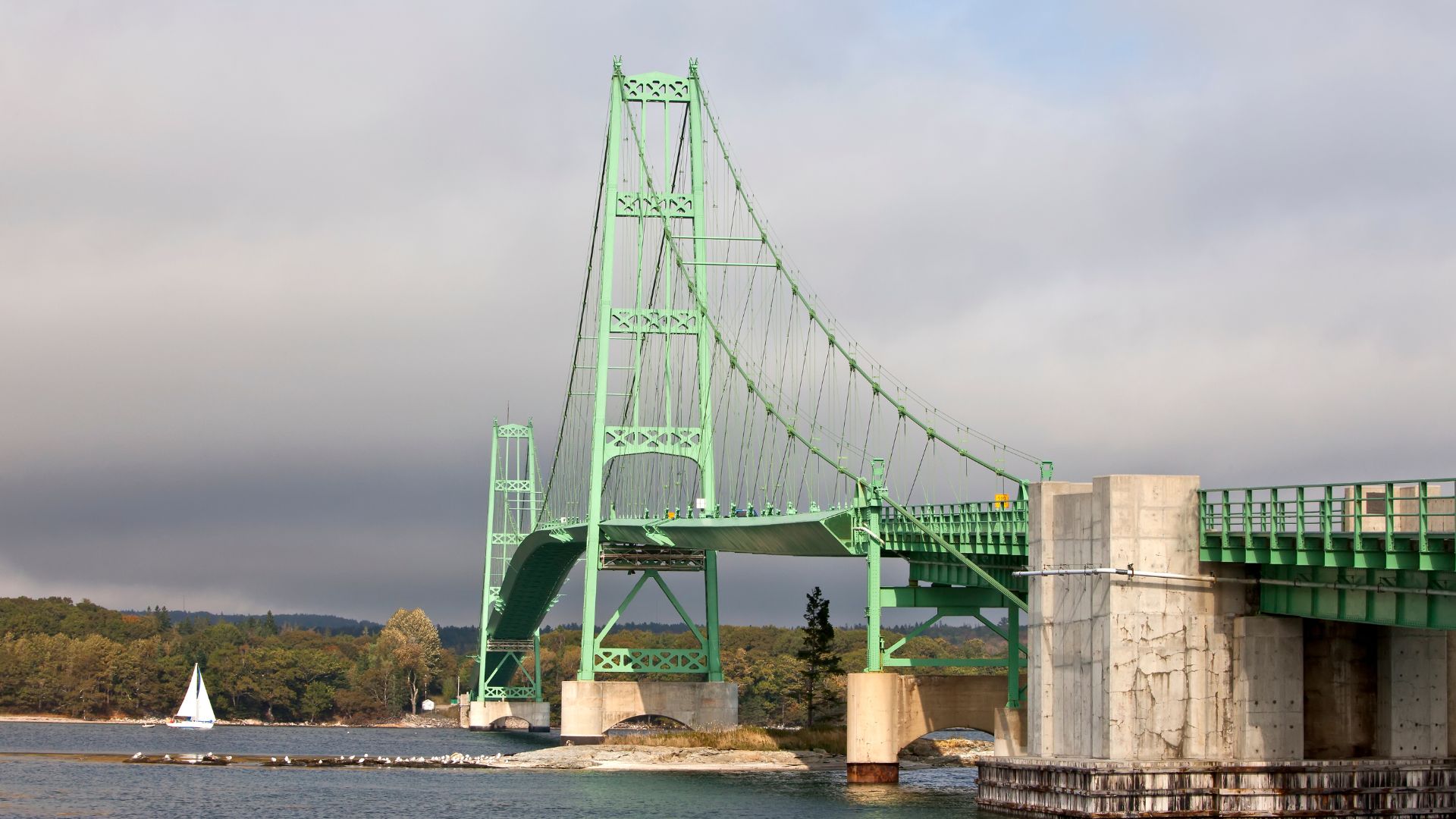 Eggemoggin Reach — the wooded eight-mile corridor under the 1939 Deer Isle bridge, home water of the American wooden-boat revival.