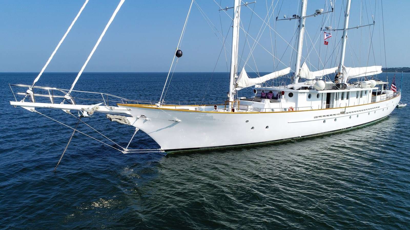 A three-masted classic schooner at anchor on New England water