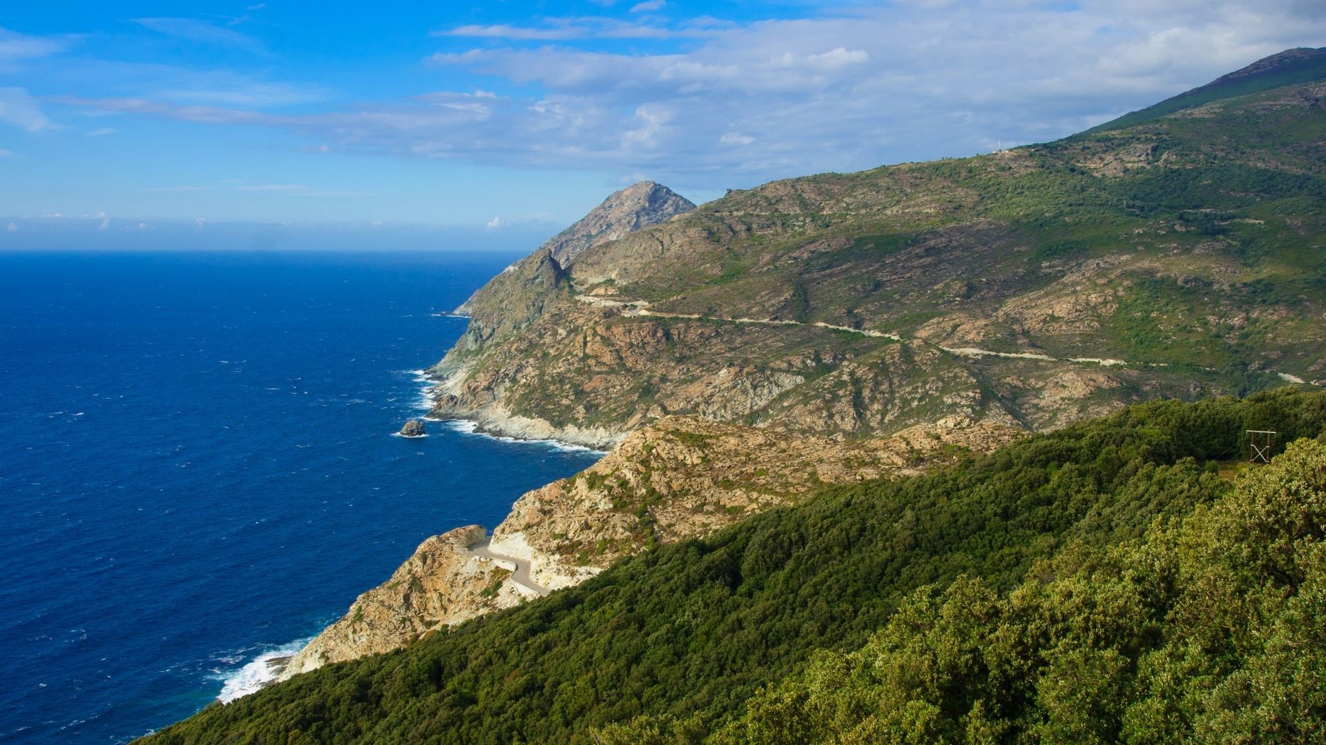 Cap Corse — forty kilometers of rugged west-coast cliffs with terraced villages cut into the headlands. Quieter than the Calvi-Saint-Florent stretch and rarely visited by charter traffic.