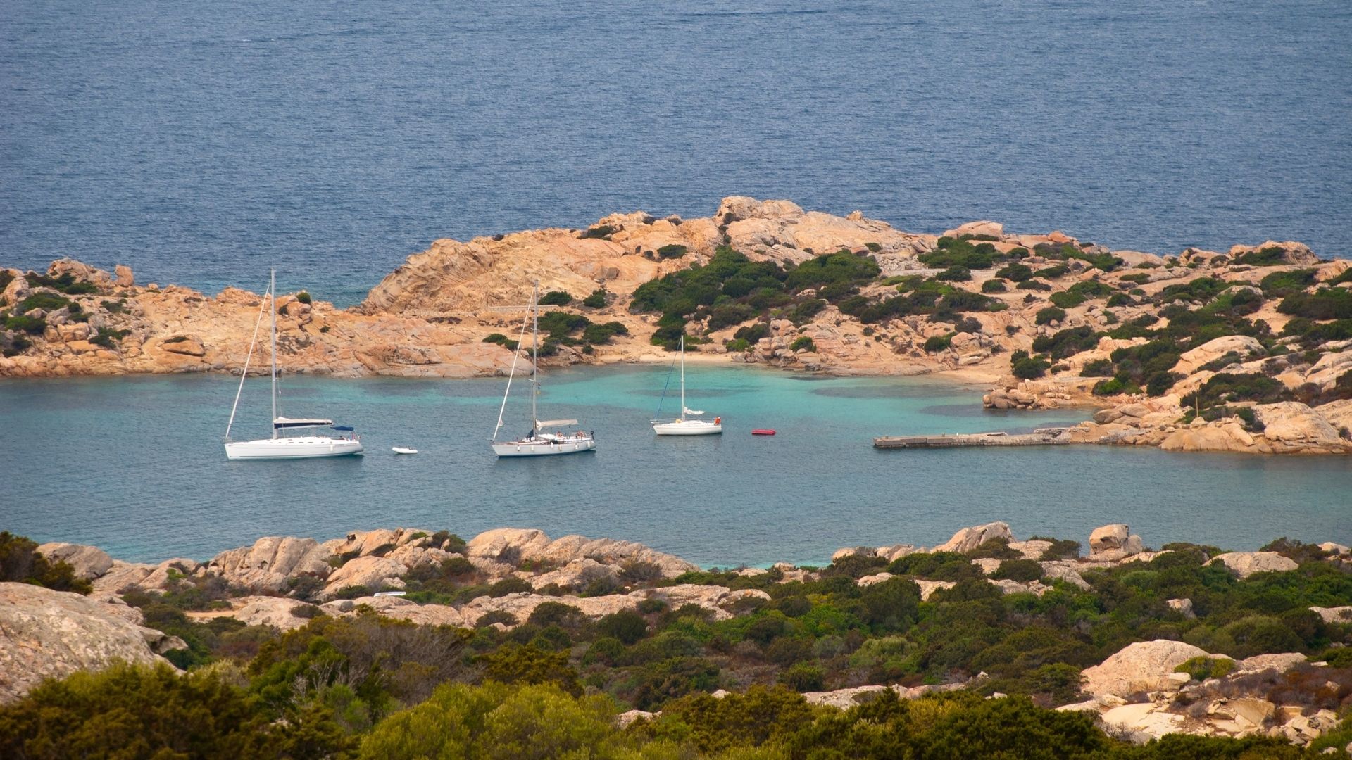 Caprera — the second-largest island in the Maddalena Archipelago. Most guests come for the granite coves on the south coast; Garibaldi's preserved house museum sits a short walk inland.