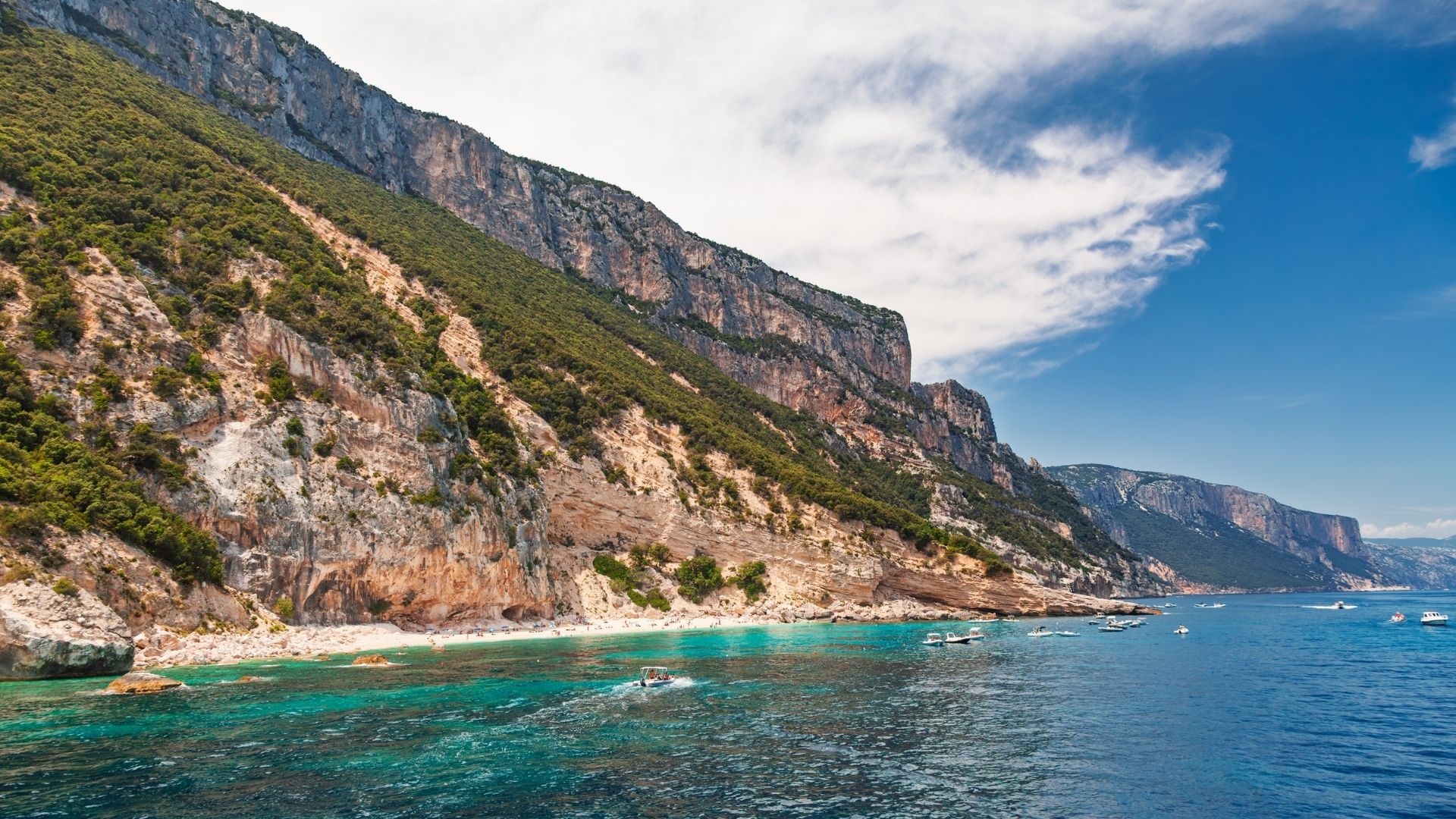 Limestone cliffs of the Golfo di Orosei rising from the sea — east coast of Sardinia