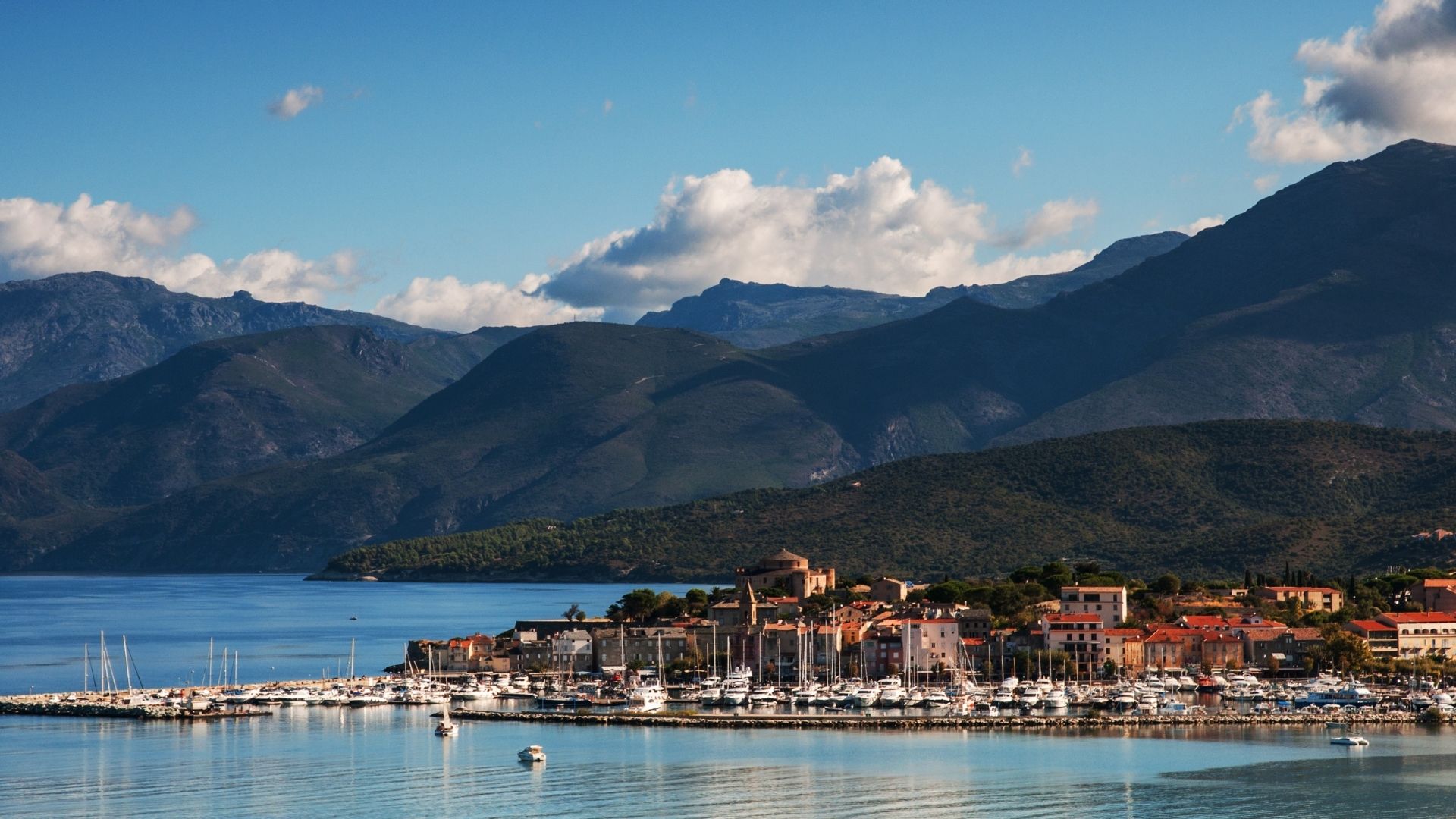 Saint-Florent sits at the southern base of Cap Corse — a working yacht harbor, a Genoese citadel, and the gateway to the Patrimonio vineyards a few kilometers inland.