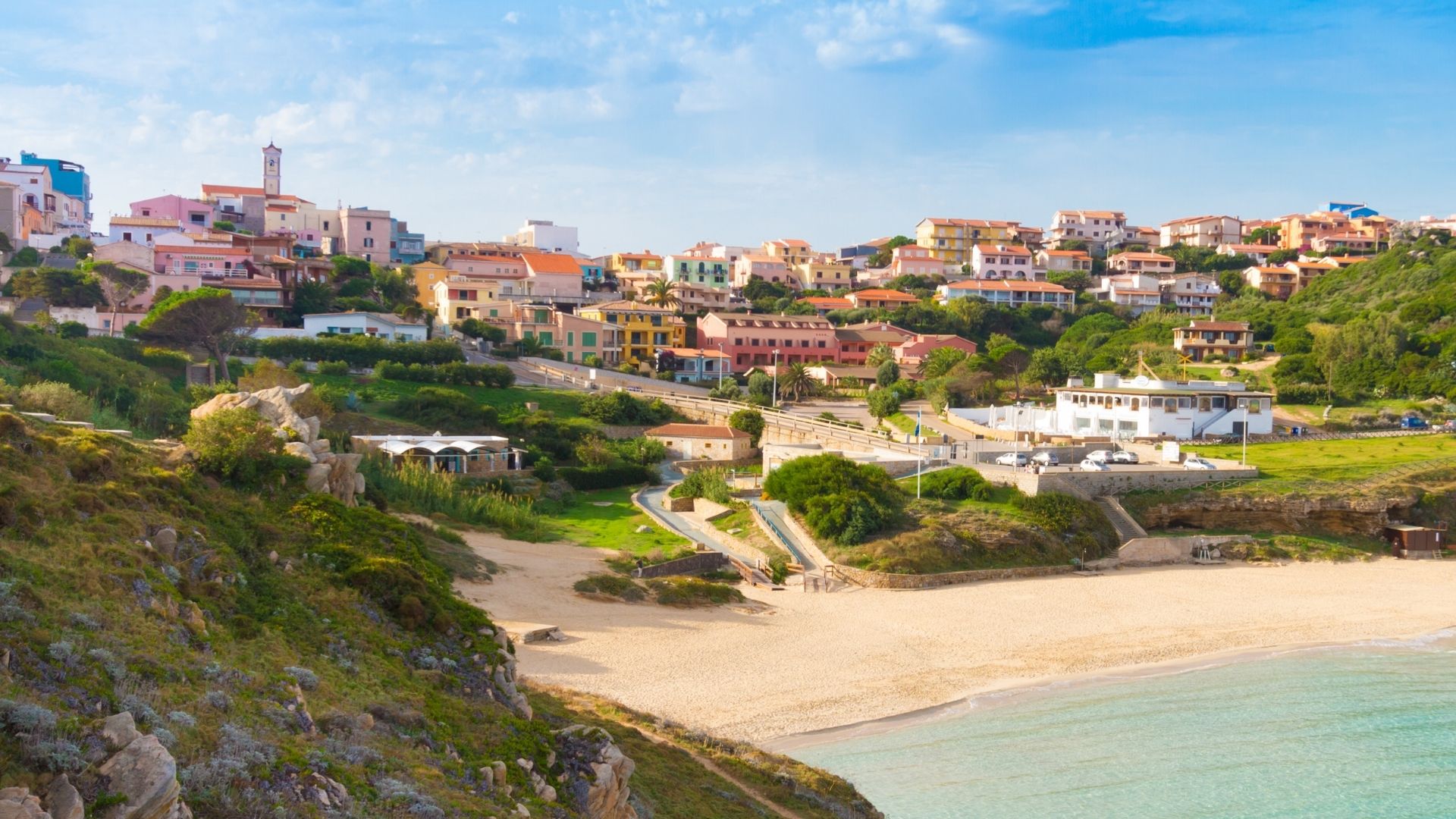 Santa Teresa Gallura sits on the northern tip of Sardinia, six miles from Bonifacio across the strait. The Spanish watchtower above the harbor dates from the late sixteenth century.