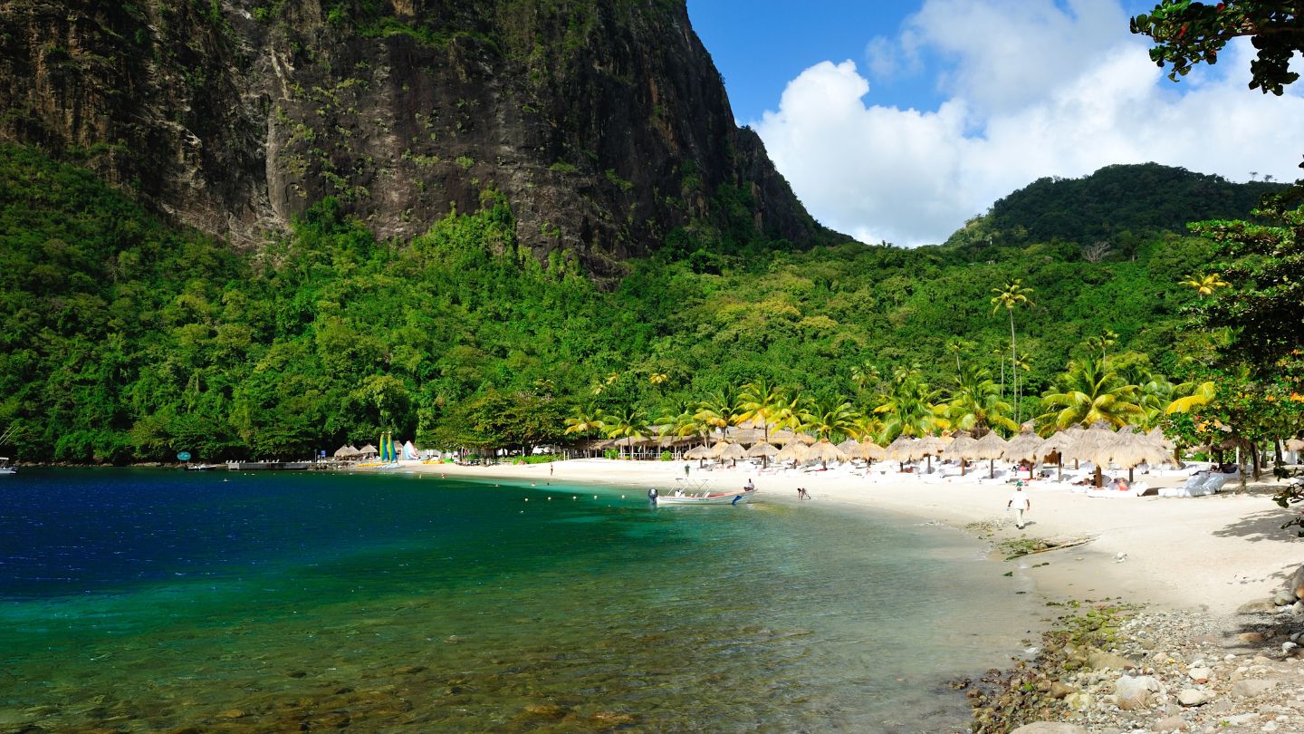 Sugar Beach in the notch between the peaks — a tender ride from the mooring.