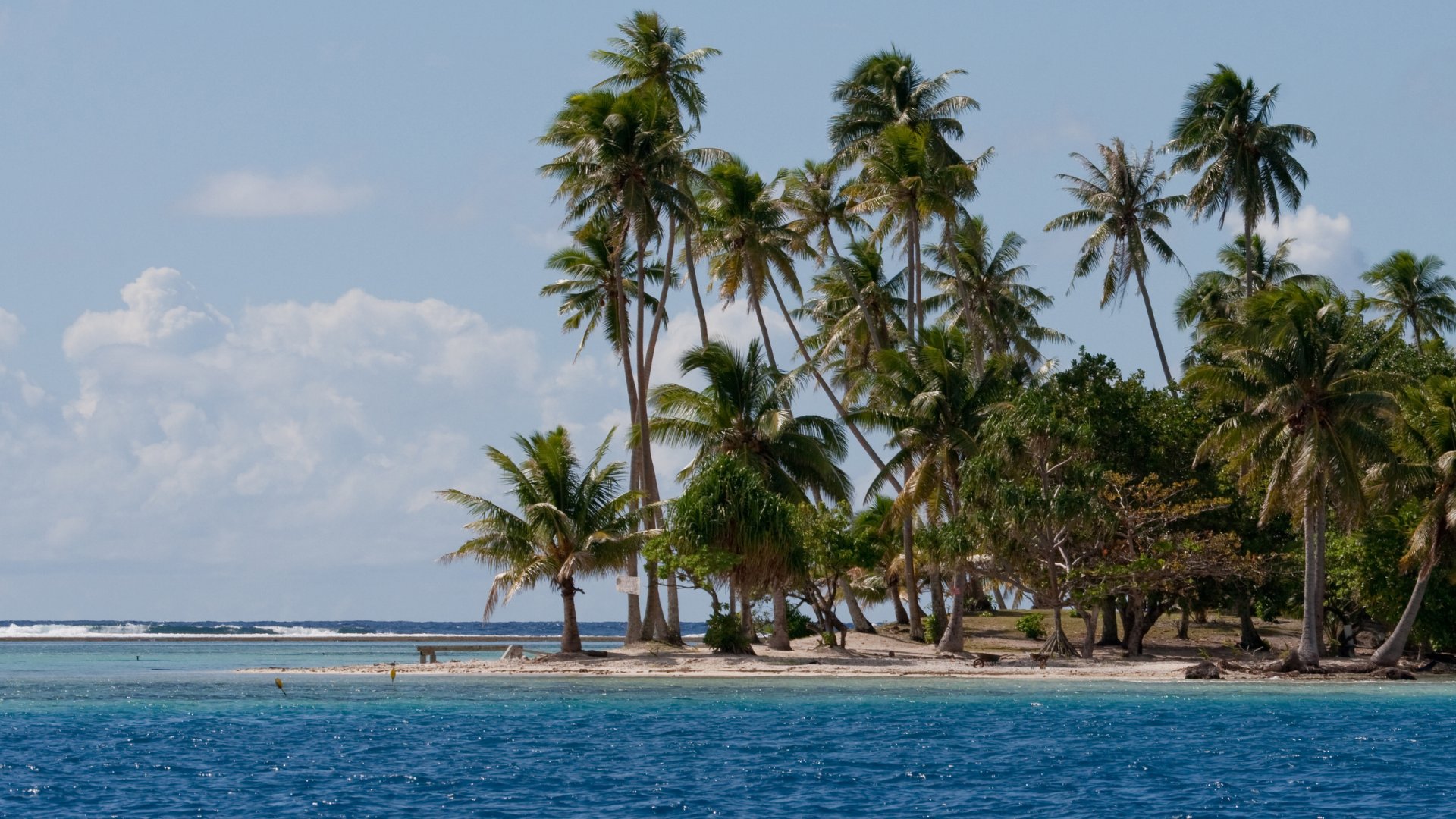 Taha'a from above, ringed by its shared barrier reef.