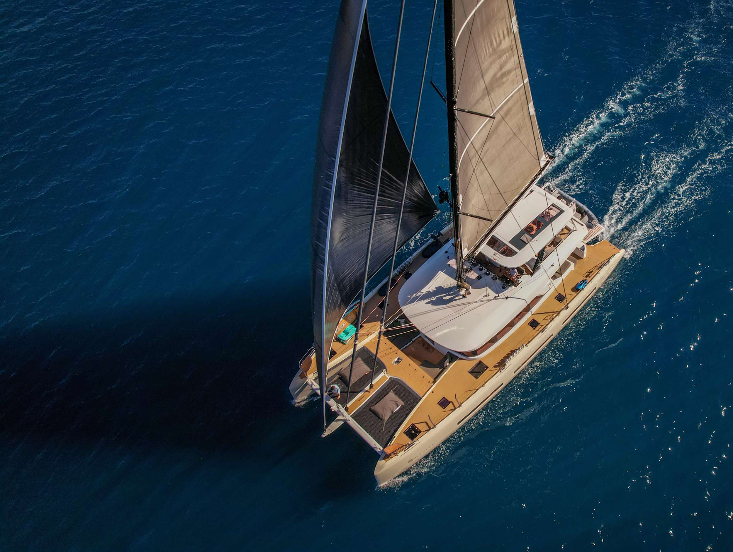 Aerial of a crewed sailing catamaran in the US Virgin Islands