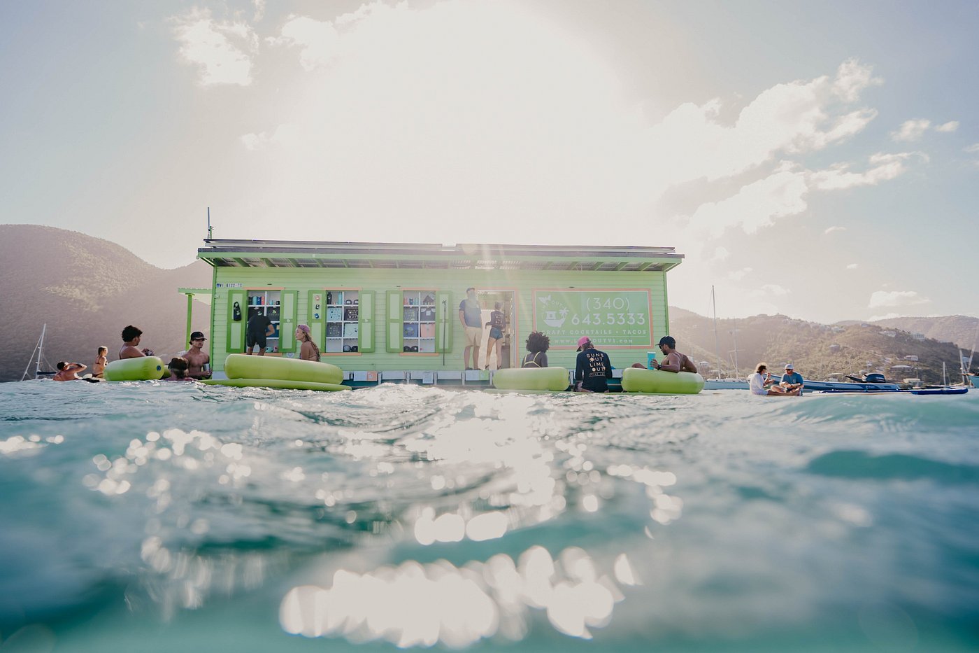 Lime Out — the floating taco bar moored in the middle of Coral Bay. You dinghy over, tie up to a knotted rope, and order from the water. (Photo: Lime Out VI)